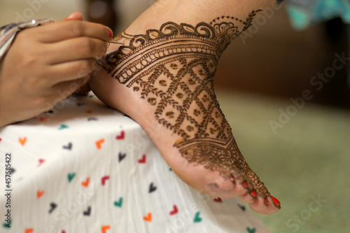 Ledy Feet and Hands in Heena for wedding in white background and isolated hand and feet  | hand design | feet design | beautiful design | nice design 