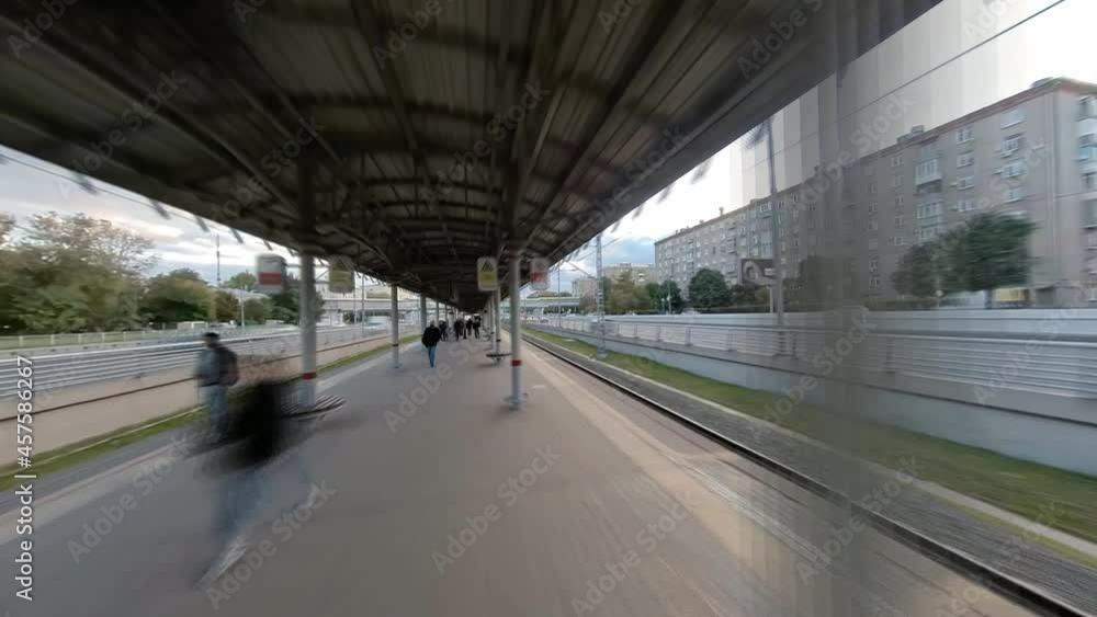Movement together with the passengers of the train on the overpass, escalator and platform of the train, time lapse Movement together with the passengers of the train on the overpass, escalator and platform of the train, time lapse