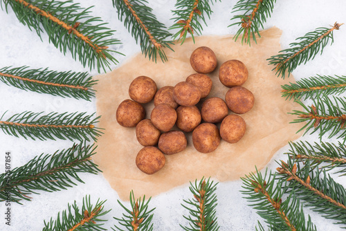 Marzipan potatoes, in german called Marzipankartoffeln, with cacao powder, sweets for christmas, empty copy space
