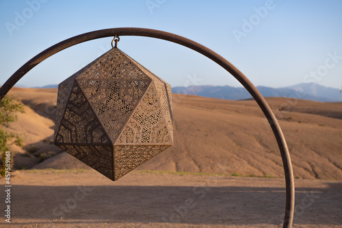 Icosahedron hanging in the desert photo