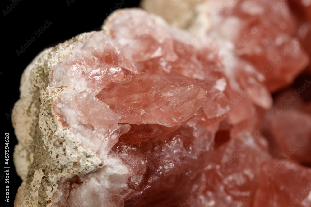 Macro mineral stone Pink Amethyst on a black background Macro mineral stone Pink Amethyst on a black background