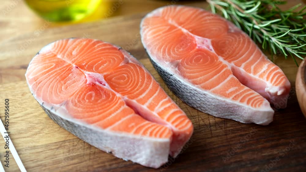 fresh salmon steak on wooden cutting board fresh salmon steak on wooden cutting board