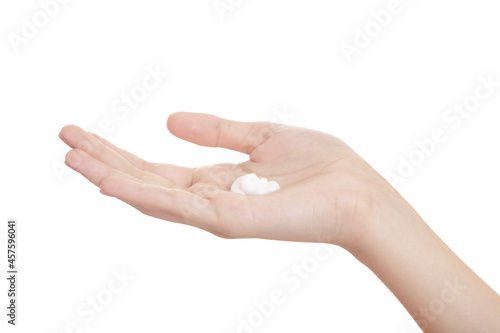 Female hands isolated on white background. Moisturizing hands with cream. Applying the cream to the skin