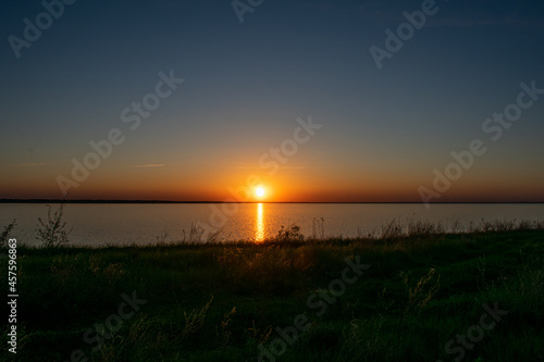 sunset on the river bank