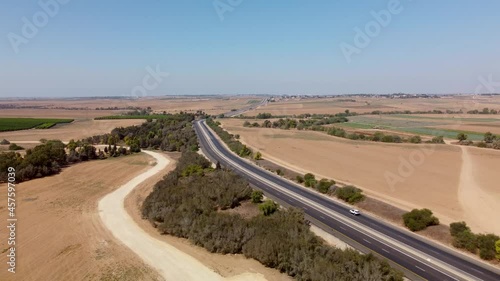 Flying backward in the sky over the highway in Southern Israel between Netivot and Sderot