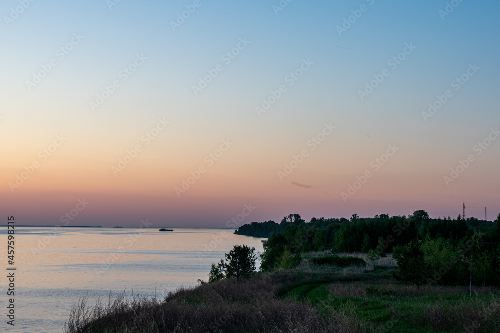 Beautiful sunset over the river in summer