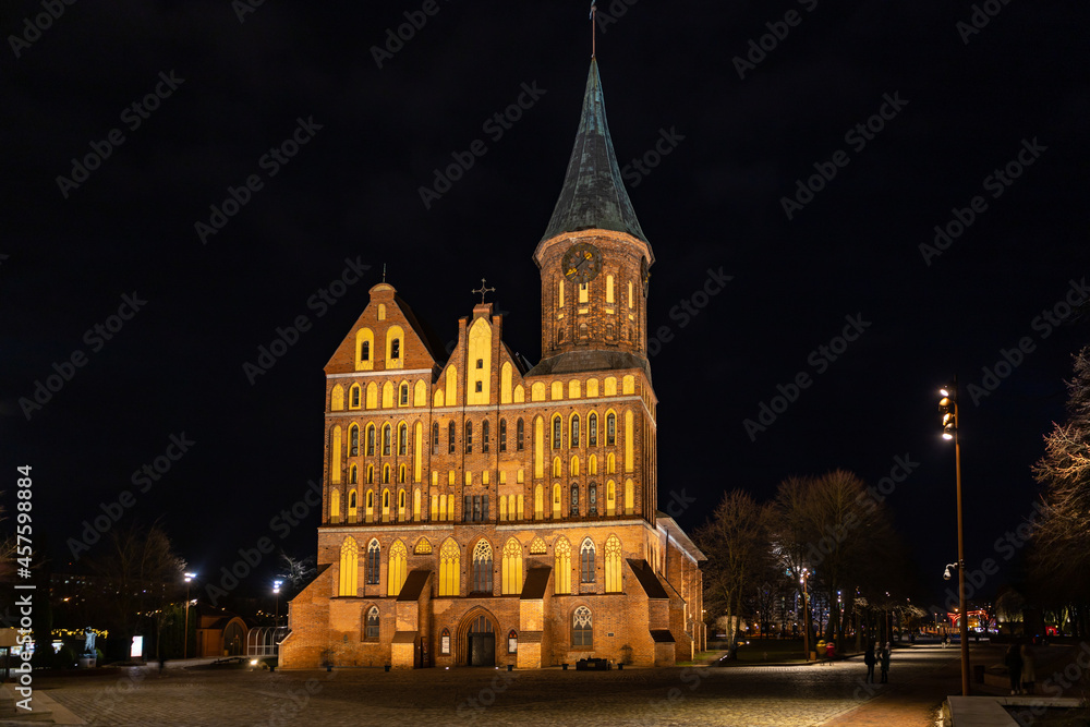 Konigsberg Cathedral (circa 1333) on Kant Island (formerly Kneiphof) of the Pregel (Pregolya) River at night. Kaliningrad, Russia.