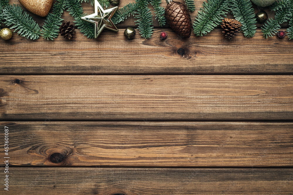 Vintage Christmas background with fir tree branches border on wooden boards
