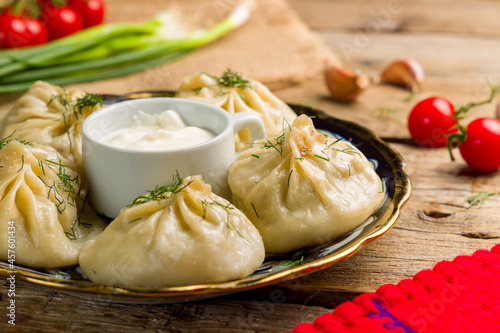 Manty with beef and sour cream, uzbek cuisine close up