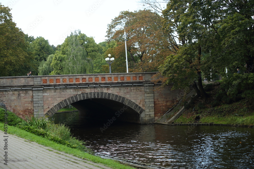 The bridge on the canal in the park of Riga. High quality photo