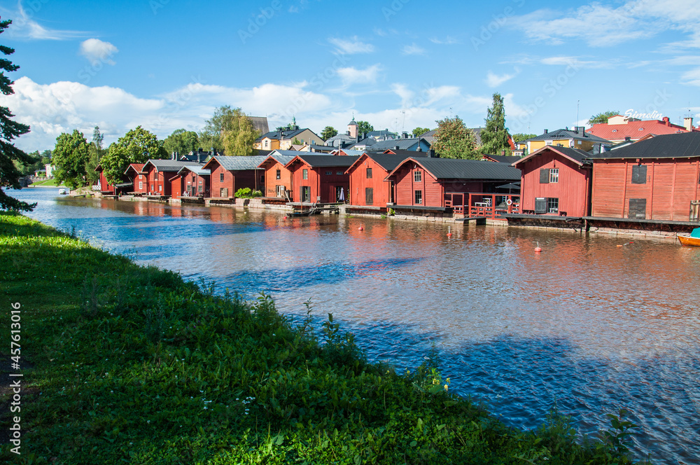 Old wooden red houses on the riverside in Porvoo, Finland