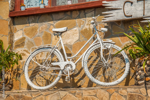 Decorative white painted old bycicle