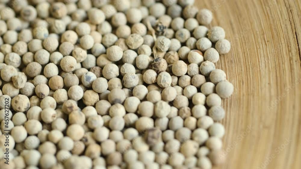 Close-up video of a slowly rotating white pepper Close-up video of a slowly rotating white pepper