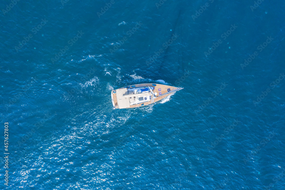 Fototapeta premium Boat on the water surface drone view.