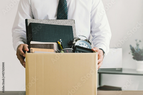 Resignation. businessmen holding boxes for personal belongings and resignation letters.Quitting a job,The big quit.The great Resignation. photo