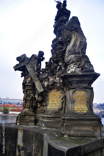 Monument ancient ruin antique stone statue on Charles Bridge crossing Vltava Moldau river for Czechia people foreign travelers travel visit at Praha city on November 11, 2016 in Prague, Czech Republic