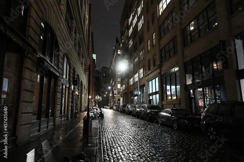 Contrary to the paved place, the alley at night