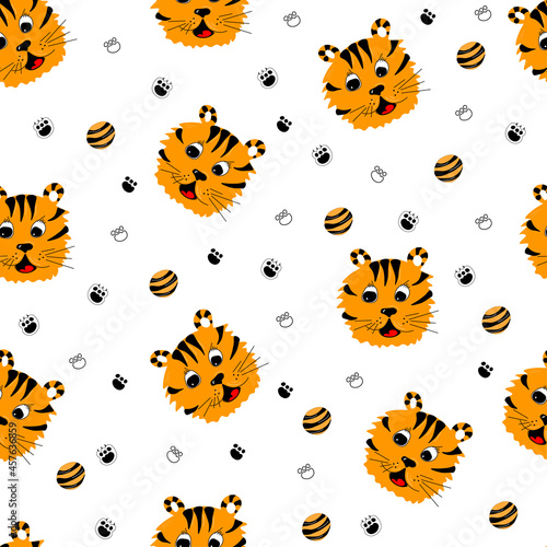 Vector seamless pattern of tiger's muzzle with paw and baby ball. Bright baby seamless pattern mockup.
