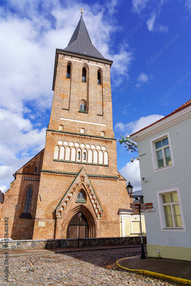 Obraz premium Brick Christian church with its high tower in the Estonian city of Tartu.