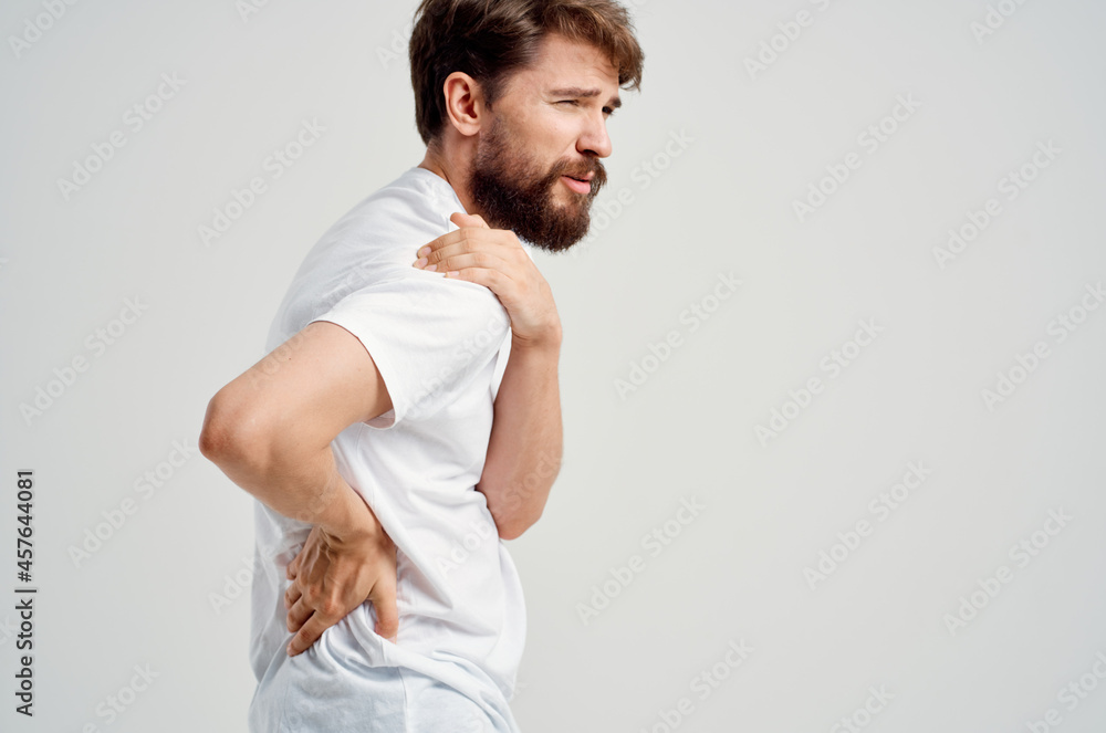 bearded man pain in the neck health problems massage therapy light background bearded man pain in the neck health problems massage therapy light background