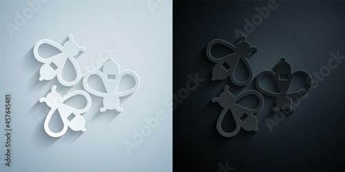 Paper cut Bees icon isolated on grey and black background. Sweet natural food. Honeybee or apis with wings symbol. Flying insect. Paper art style. Vector
