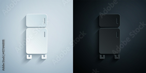 Paper cut Refrigerator icon isolated on grey and black background. Fridge freezer refrigerator. Household tech and appliances. Paper art style. Vector