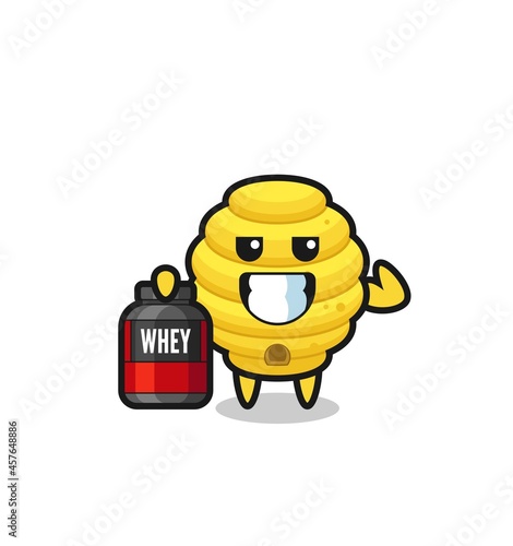 the muscular bee hive character is holding a protein supplement