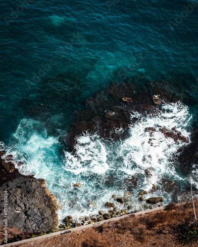 Top down aerial drone image of waves on the shore line in Puerto de la Cruz, Tenerife, Canary Islands, Spain. © Rene Hausotte
