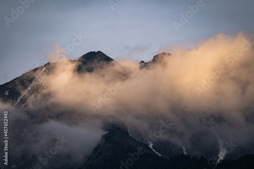 Stone mountains in thick white fog. Natural reserve. Natural monument. Hiking and travel.