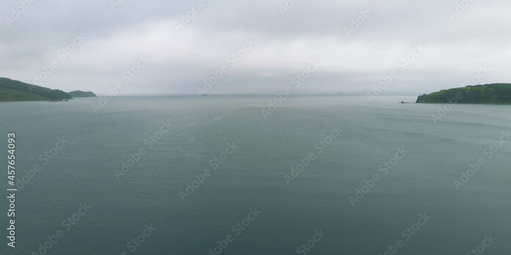 Wide open sea bay in cloudy morning. Wide open sea bay in cloudy morning.