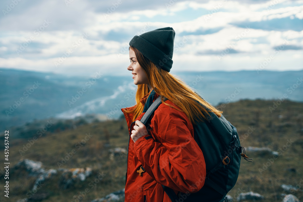 woman traveler with backpack mountains landscape freedom