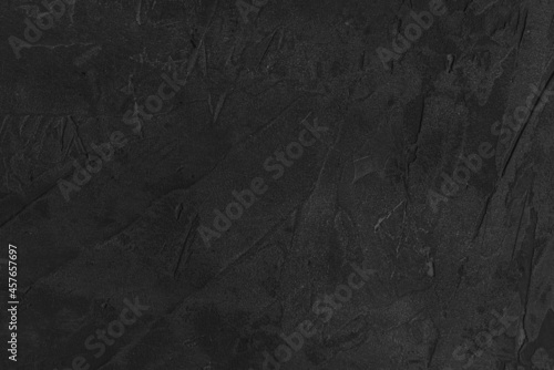 Dark cement background for a grunge-style design. A concrete wall. Grey plaster.
