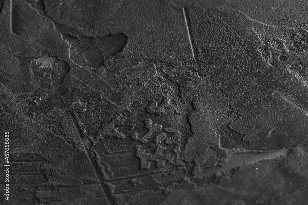 Dark cement background for a grunge-style design. A concrete wall. Grey plaster. Dark cement background for a grunge-style design. A concrete wall. Grey plaster.