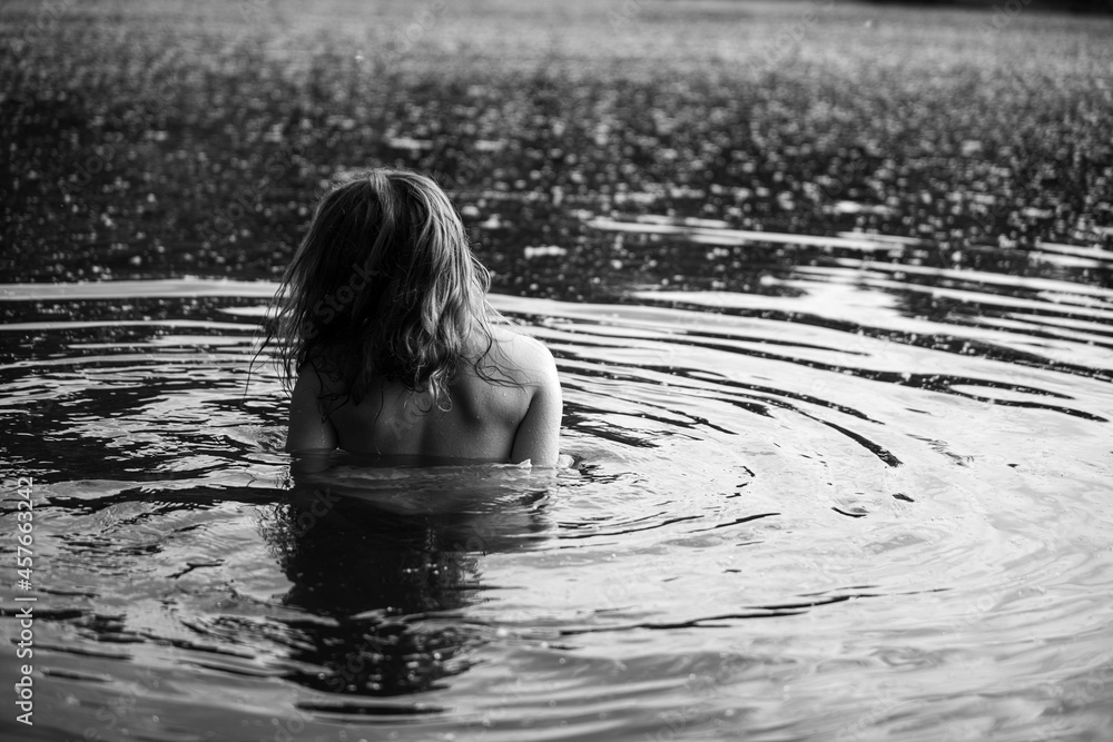 Fototapeta premium Caucasian woman in water. Monochrome