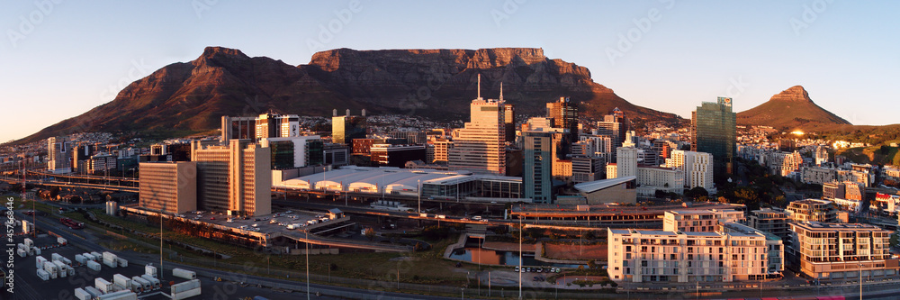 Naklejka premium Aerial panoramic view of the City of Cape Town skyline at sunrise.