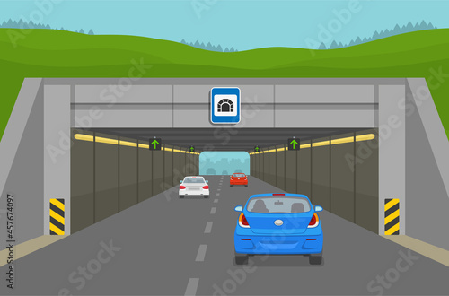 Driving a car. Blue sedan car driving into tunell. Steam of cars going through the city tunnel. Flat vector illustration template.
