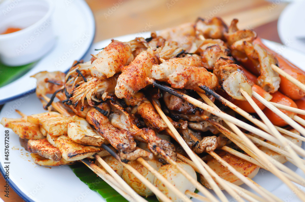 barbecued pork or spicy barbecued or spicy satay ,sausage and meatball