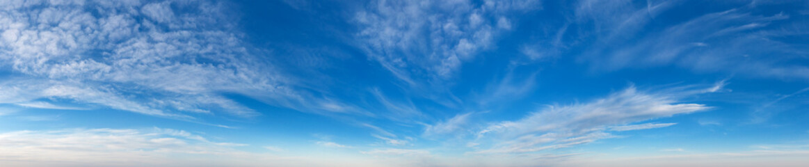 Blue Sky background with tiny Clouds. Panorama background