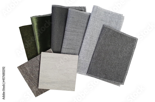 multi texture and pattern of fabric and stone tile samples swatch in grey and green color tone isolated on white background with clipping path. drapery and floor tile material for selection.