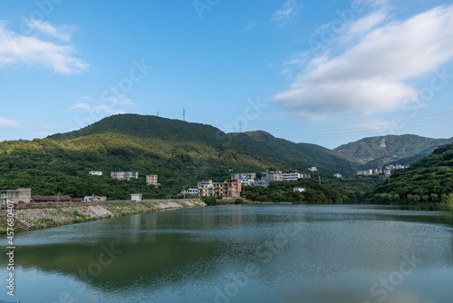 The lake reflects the mountains and villages © chen