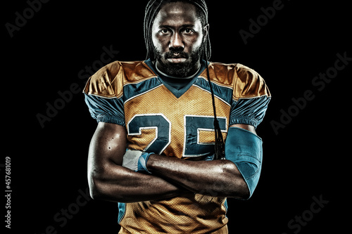 American football sportsman player isolated on black background