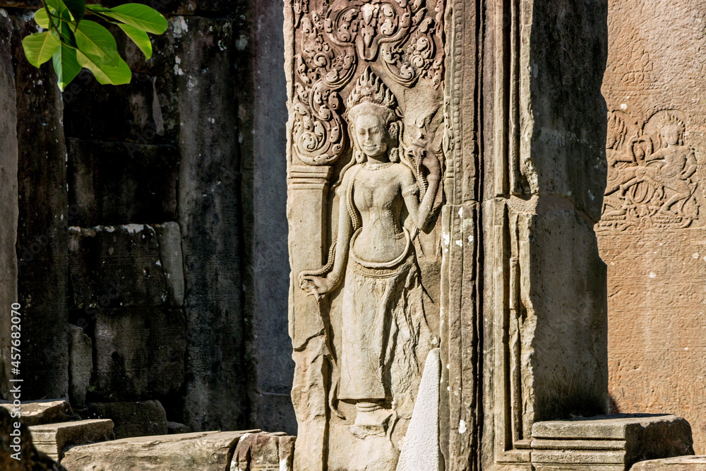 detail stone carving on wall of Khmer temple in Angkor Wat, Cambodia detail stone carving on wall of Khmer temple in Angkor Wat, Cambodia