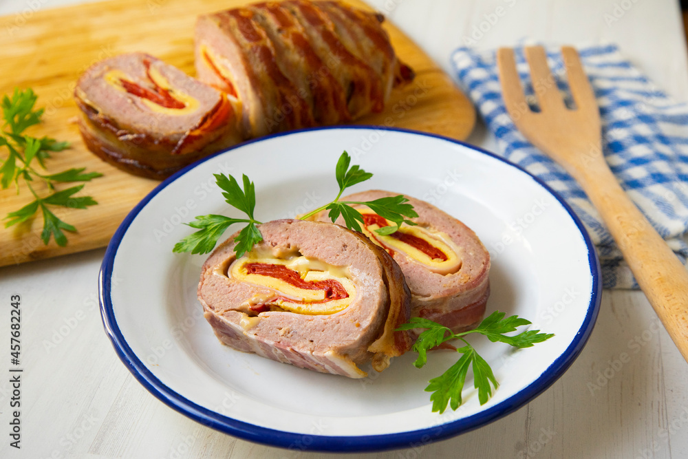 Roast beef roll stuffed with peppers, ham, cheese and omelette. Roast beef roll stuffed with peppers, ham, cheese and omelette.