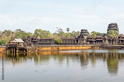 old ruins of Angkor Wat temple at lakeside in Cambodia 