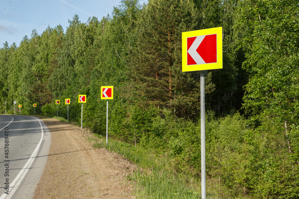 Road signs warning dangerous road curve. Dangerous turn. Road signs warning dangerous road curve. Dangerous turn.
