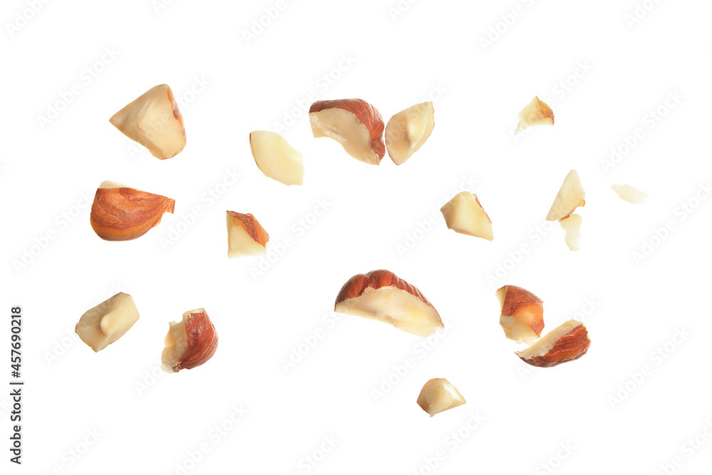 Pieces of tasty hazelnuts on white background Pieces of tasty hazelnuts on white background
