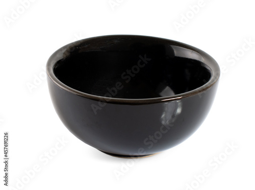 Empty black ceramic bowl isolated on white background