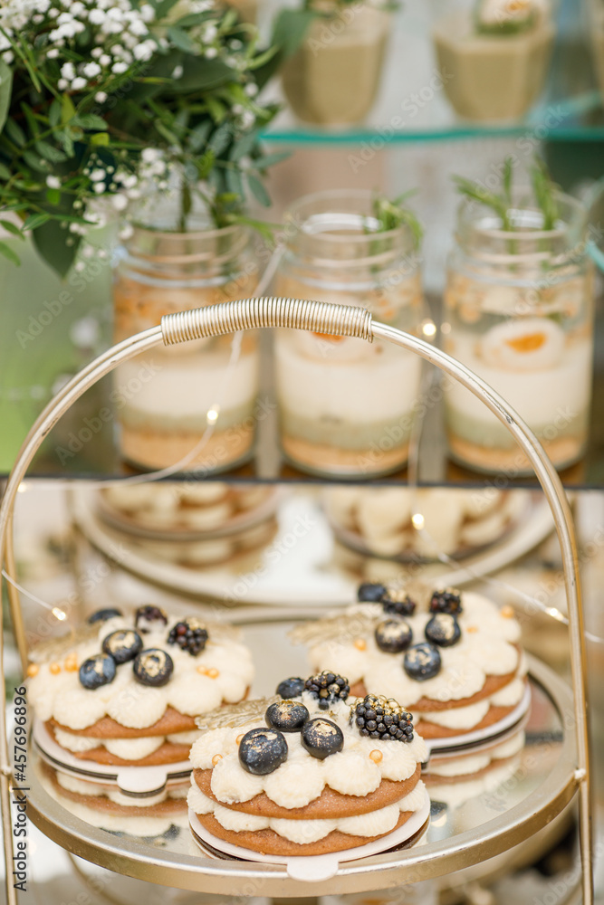 Candy Bar. Delicious wedding buffet with cupcakes. Sweet buffet with cupcakes and other desserts. Candy Bar. Delicious wedding buffet with cupcakes. Sweet buffet with cupcakes and other desserts.