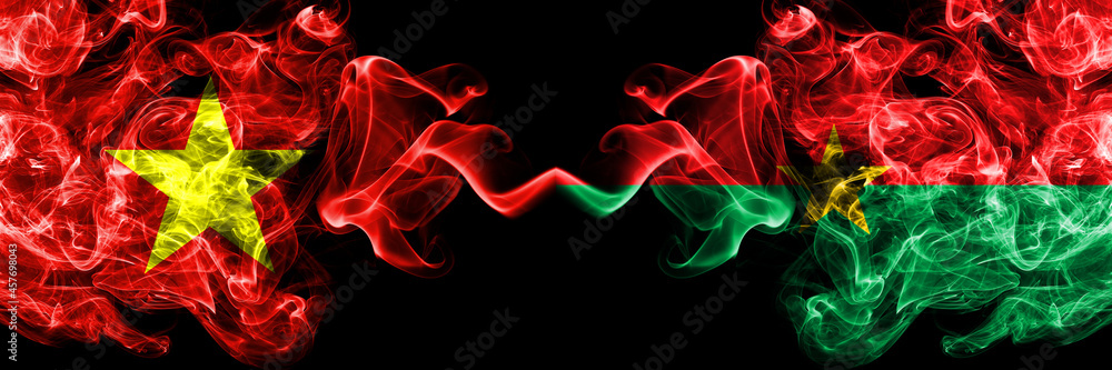 Vietnam, Vietnamese vs Burkina Faso, Burkinese smoke flags side by side. Vietnam, Vietnamese vs Burkina Faso, Burkinese smoke flags side by side.