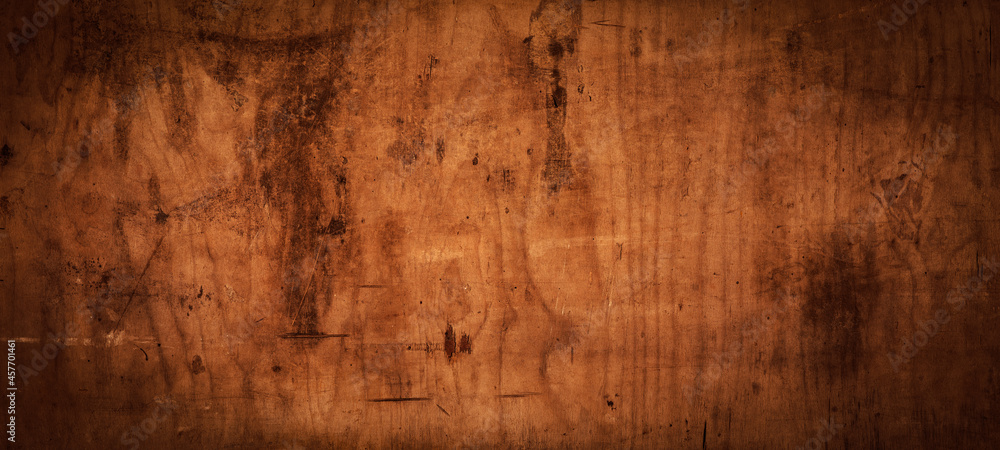 old brown rustic weathered scratched dirty dark wooden table wall texture - wood timber background panorama banner.